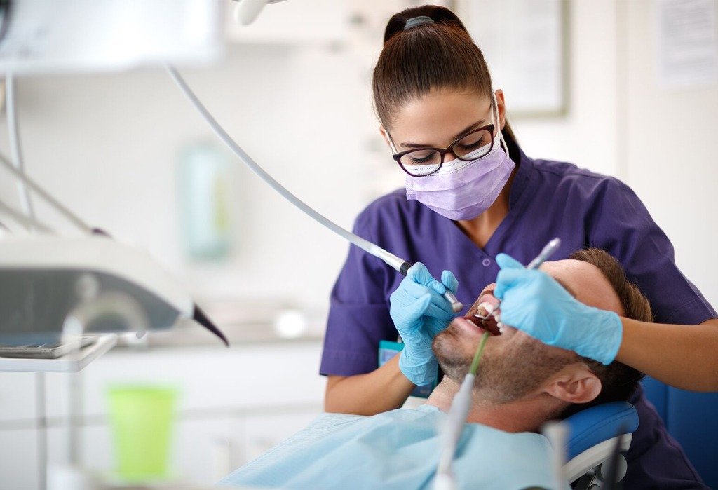 Dental implant procedure and clinical restoration at Smile And Skin Co.